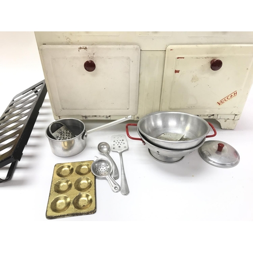 86 - A Vintage Childs Vulcan tin Kitchen Stove With Utensils.