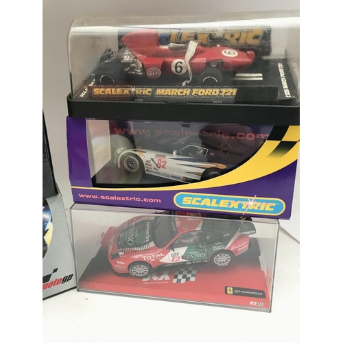 1010 - A Collection of Boxed Scalextric Cars including a SCX Ferrari 530 Maranello. A March Ford 721. A Dod... 