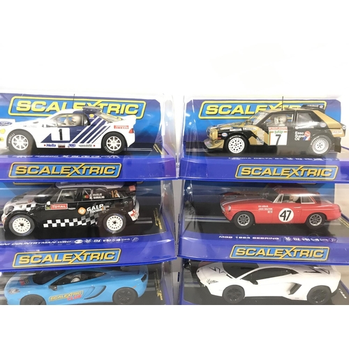 1024 - 6 X Boxed Scalextric Cars. Including a Ford RS200. A Lancia Delta. A Mini Countryman WRC. A MGB 1964... 