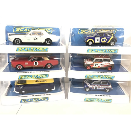 1026 - 6 Boxed Scalextric Cars. 2 X Ford Mustangs. A Volkswagen T1B. 2X Mini Miglias and a Mini 1275GT.