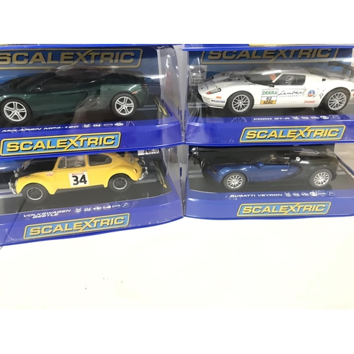 1027 - 6 Boxed Scalextric Cars including a Ford Cortina. 2 X McLaren MP4-12C. A Ford GT-R. A Bugatti Veyron... 