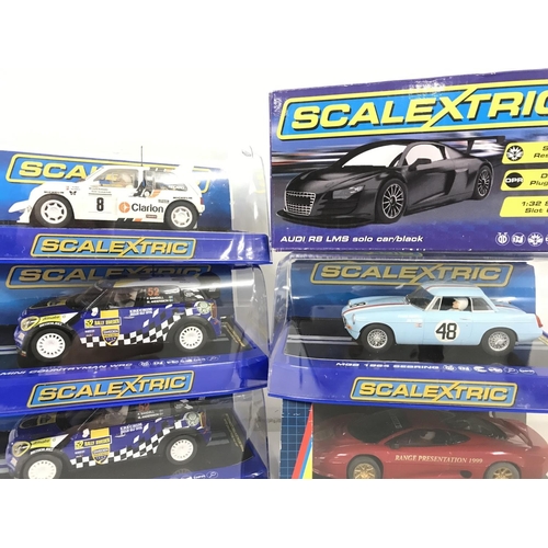 1041 - 6 X Boxed Scalextric Cars. A MG Metro 6R4. 2 X Mini Countryman WRC. A Audi R8 LMS Solo Car. A MGB 19... 