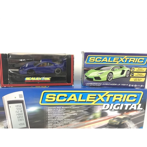 1049 - 3 X Boxed Scalextric Cars. A Boxed Ninco Cars and a Scalextric Advanced 6 Car Powerbase. (2).