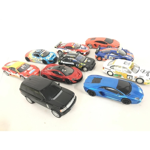 1055 - A Collection of 10 Various Scalextric Cars including a Range Rover.