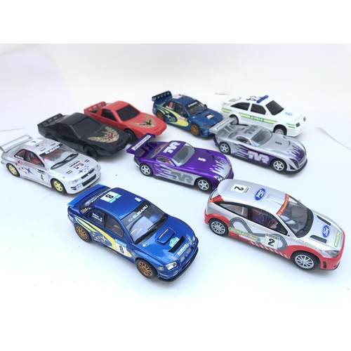 1004 - A Collection Of Scalextric Cars Including Subaru. Ford Focus. Etc.