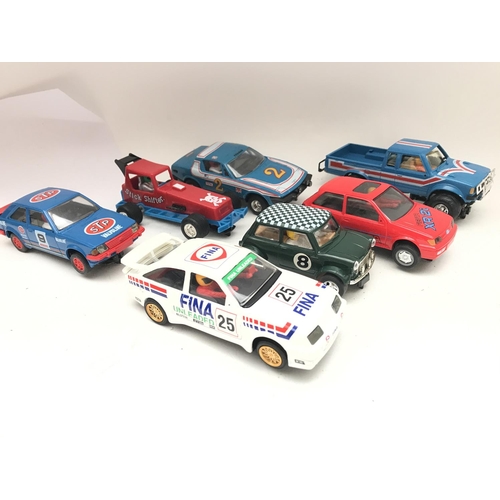 1005 - A Collection of Scalextric Cars including Mini. A Fiesta XR2i. Etc.