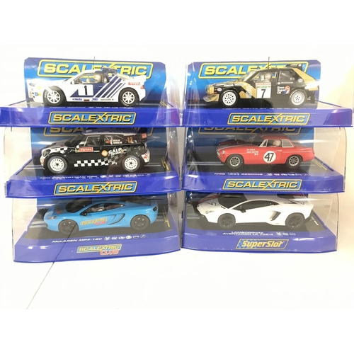 1024 - 6 X Boxed Scalextric Cars. Including a Ford RS200. A Lancia Delta. A Mini Countryman WRC. A MGB 1964... 