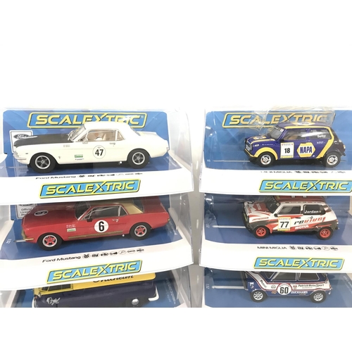 1026 - 6 Boxed Scalextric Cars. 2 X Ford Mustangs. A Volkswagen T1B. 2X Mini Miglias and a Mini 1275GT.