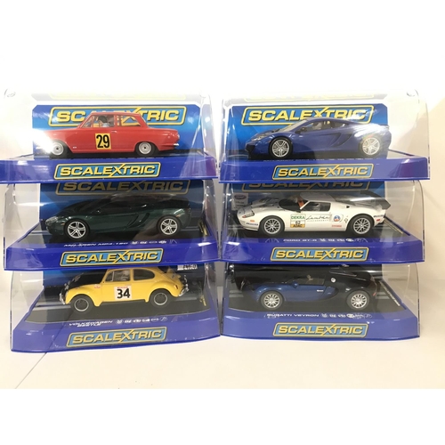 1027 - 6 Boxed Scalextric Cars including a Ford Cortina. 2 X McLaren MP4-12C. A Ford GT-R. A Bugatti Veyron... 