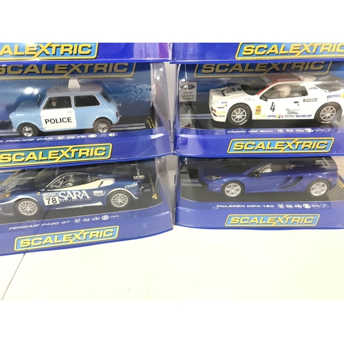 1028 - 6 Boxed Scalextric Cars. 2 x McLaren MP4-12C. A Range Rover HM Coastguard. A Mini Police Car. A Ford... 