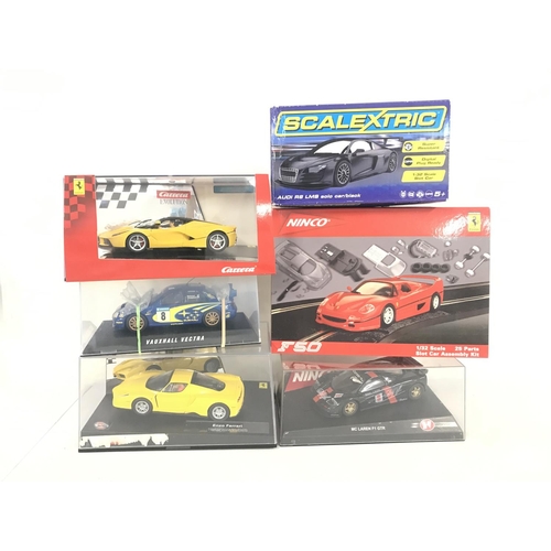 1048 - A Collection of 6 Boxed Slot Cars Including Scalextric. Ninco and Carrera.