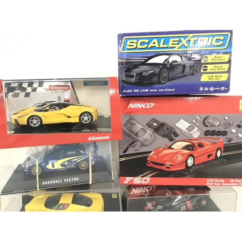 1048 - A Collection of 6 Boxed Slot Cars Including Scalextric. Ninco and Carrera.