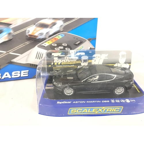 1049 - 3 X Boxed Scalextric Cars. A Boxed Ninco Cars and a Scalextric Advanced 6 Car Powerbase. (2).