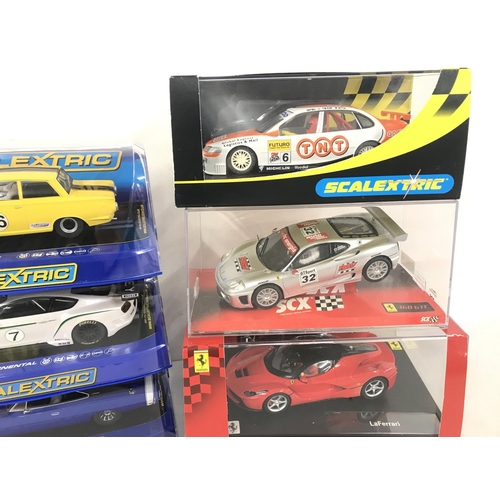 1052 - 6 X Boxed Slot Cars including Scalextric. SCX and Carrera.