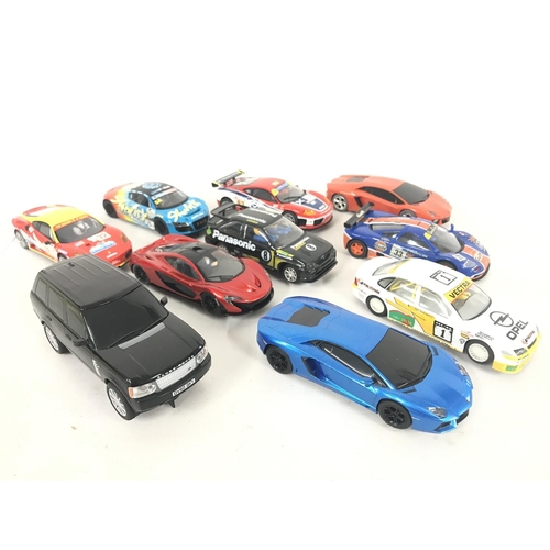 1055 - A Collection of 10 Various Scalextric Cars including a Range Rover.