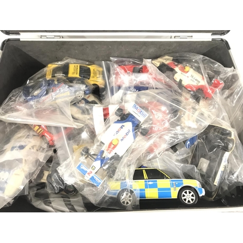 1057 - A Case containing Scalextric cars. Ideal for Spare Parts Etc.