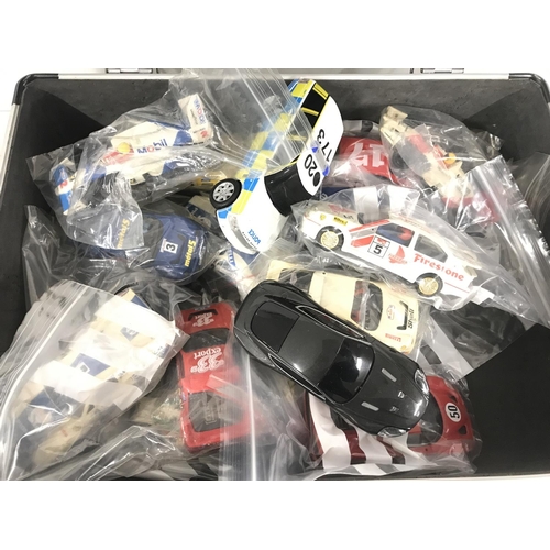 1057 - A Case containing Scalextric cars. Ideal for Spare Parts Etc.