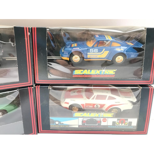 921 - 4 Boxed Scalextric Cars. Including a Martini Lancia.a Aston Martin.etc.