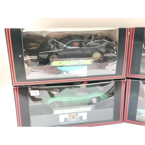 921 - 4 Boxed Scalextric Cars. Including a Martini Lancia.a Aston Martin.etc.