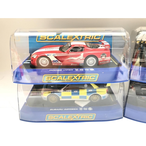 923 - 4 X Boxed Scalextric Cars. A Dodge Viper. A Aston Martin DBS. A Subaru Impreza. An a Ford GT.