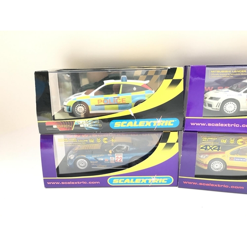 924 - 4 X Boxed Scalextric Cars. A Dodge Viper. A Peugeot 307. A Mitsubishi Lancer Evo and a Ford Focus Po... 