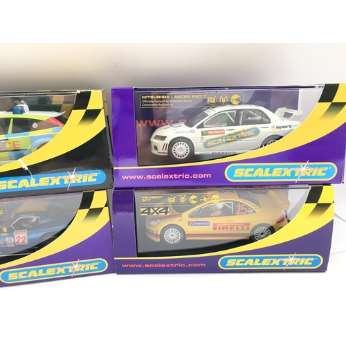 924 - 4 X Boxed Scalextric Cars. A Dodge Viper. A Peugeot 307. A Mitsubishi Lancer Evo and a Ford Focus Po... 