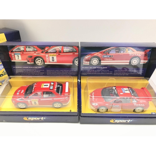 938 - 4 X Boxed Scalextric Sport Cars. 2X Minis. A Mitsubishi Lancer Evolution and a Peugeot 307 WRC.