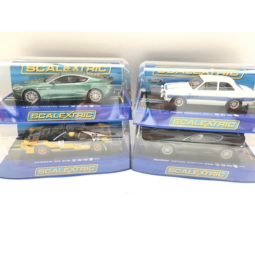 943 - 4 Boxed Scalextric Cars. 2 Aston Martins DB5. A Ferrari 308 GTB and a Ford Escort MK1.