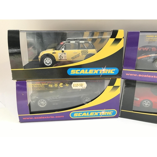 944 - 4 X Boxed Scalextric Cars. A Mini Cooper. A Mercedes-Benz SLR McLaren. A Ford GT40 and a Vauxhall Ve... 