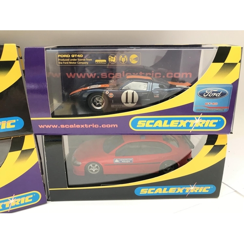 944 - 4 X Boxed Scalextric Cars. A Mini Cooper. A Mercedes-Benz SLR McLaren. A Ford GT40 and a Vauxhall Ve... 