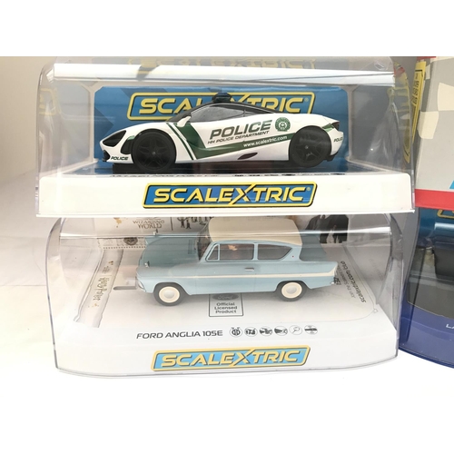 955 - 4 X Boxed Scalextric Cars. A McLaren 720s Police Car. A Harry Potter Ford Anglia 105E. A Mini Cooper... 