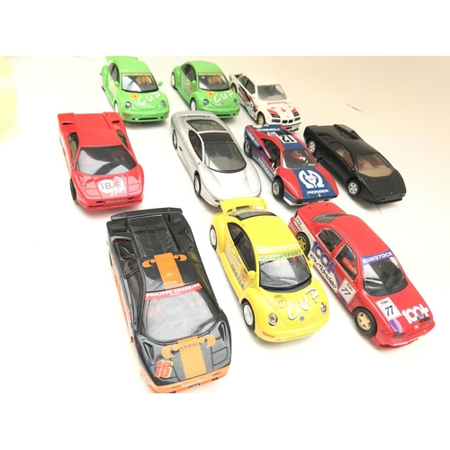 987 - A Collection of 10 Scalextric Cars. Including VW Beatles. Ferrari etc.