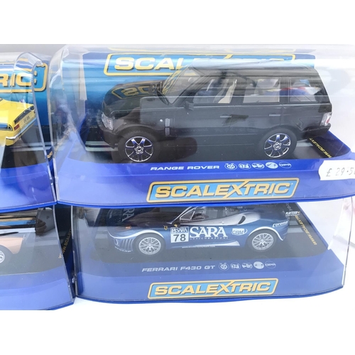 994 - 4 X Boxed Scalextric Cars a Ford Escort MK1. A Range Rover. A Ford GT40 and a Ferrari F430 GT.