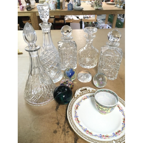 1014 - A collection of cut glass decanters, paperweights, a modern Chinese small vase and a ceramic dish. T... 