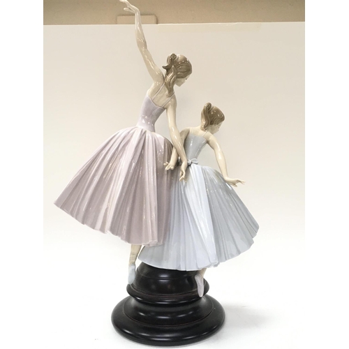 1027 - A large Lladro Merry Ballet porcelain figure group. 49cm tall.This lot cannot be posted