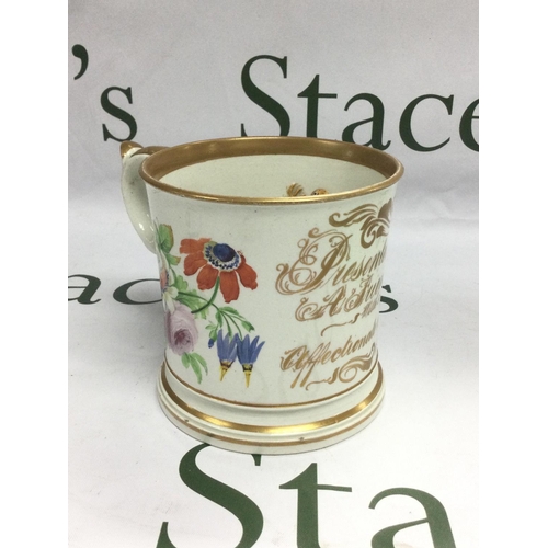 1035 - A large late 19th Century ceramic mug decirated with floral sprays and script with applied frogs and... 