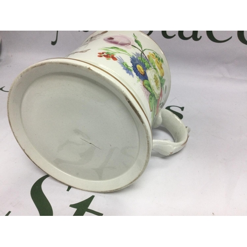 1035 - A large late 19th Century ceramic mug decirated with floral sprays and script with applied frogs and... 