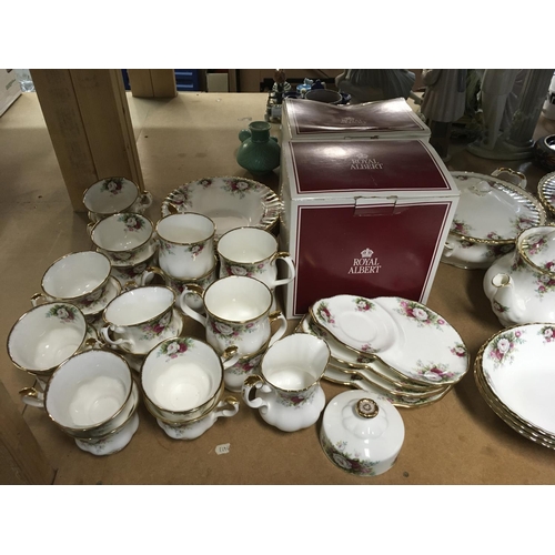 1057 - A large collection of Royal Albert tea and dinner ware, comprising tureens, two cake stands, coffee ... 