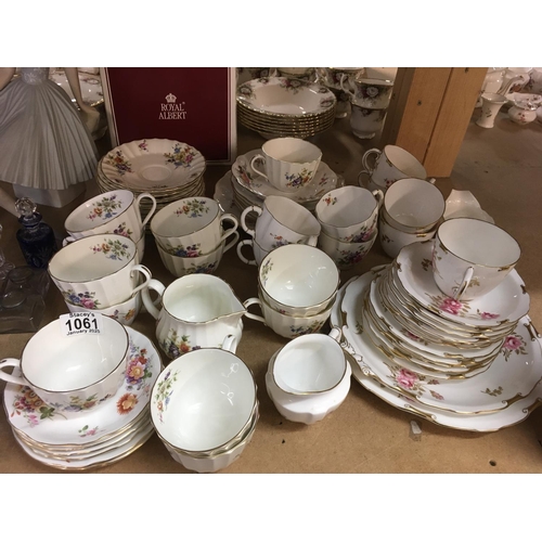 1061 - Three part tea sets including Royal Crown Derby, Royal Worcester- decorated with flowers and foliage