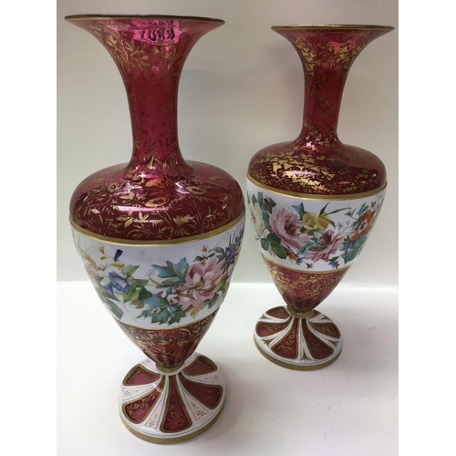 1064 - Two bohemian glass vases with gilt folate decoration, overlaid with flowers and foliage. 39cm in hei... 