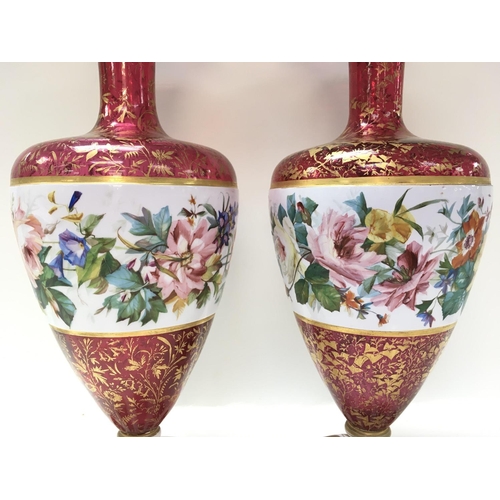 1064 - Two bohemian glass vases with gilt folate decoration, overlaid with flowers and foliage. 39cm in hei... 