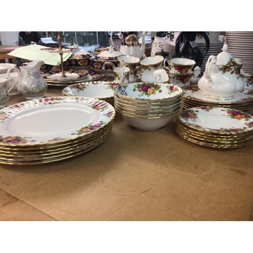 1073 - A Royal Albert old English Country Rose tea and dinner set comprising cups sauces small tea pot grad... 