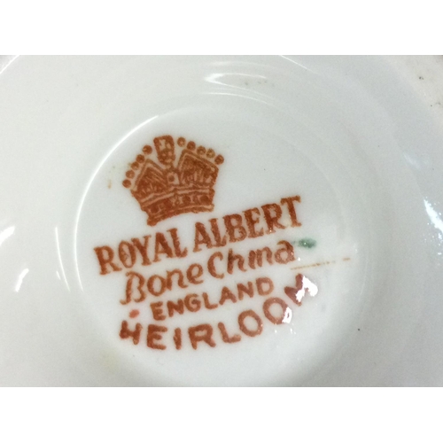 1074 - A large Royal Albert Heirloom pattern tea and dinner set including plates, cups, saucers etc . This ... 