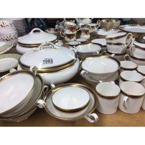 1085 - A Spode porcelain dinner service with coffee cups tea cups tureens plates all with a blue and gilded... 