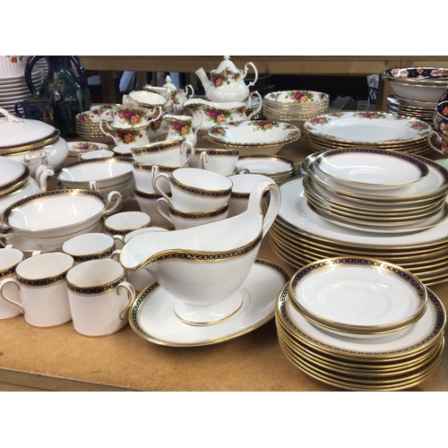 1085 - A Spode porcelain dinner service with coffee cups tea cups tureens plates all with a blue and gilded... 