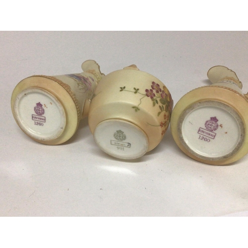 1087 - A pair of Royal Worcester hand painted vases with raised handles and a small posy pot all without an... 