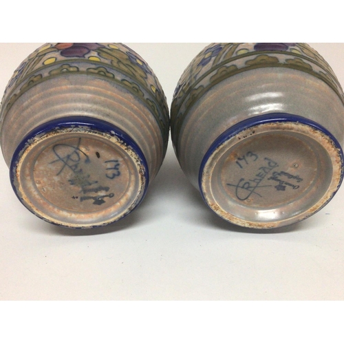 1091 - A pair of Charlotte Rheed ceramic vases hand decorated with a floral pattern. No obvious damage or r... 