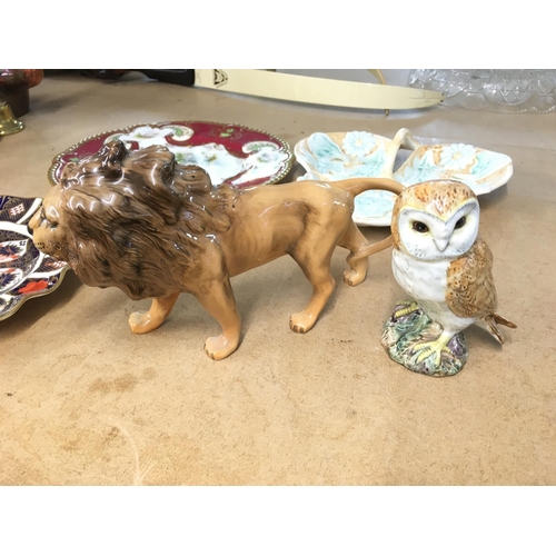 1101 - A Beswick lion and owl and other ceramics including crown Derby plate etc.