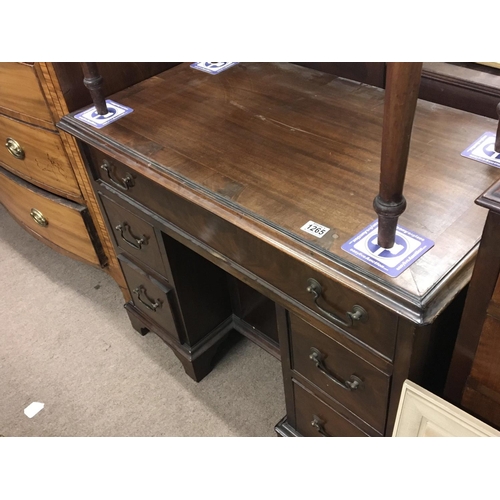 1210 - A George III Mahogany kneehole desk fitted with one long drawer and graduating drawers on bracket fe... 