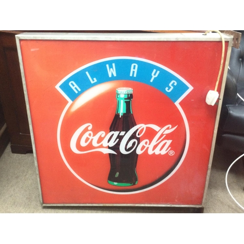 1211 - A vintage double sided Coca Cola illuminating advertising sign, dimensions 75x75. This lot cannot be... 